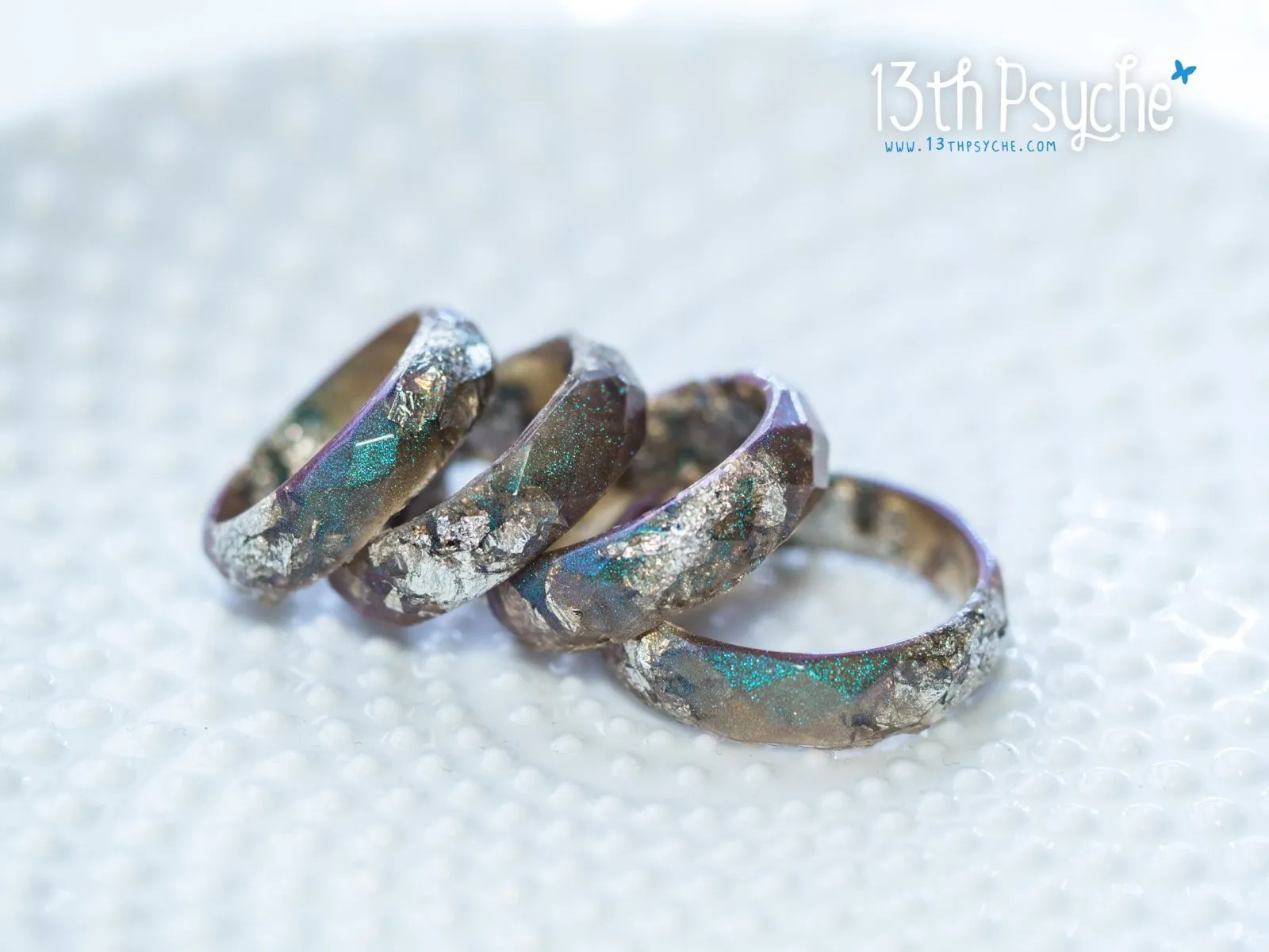 Iridescent grey faceted resin ring with silver flakes