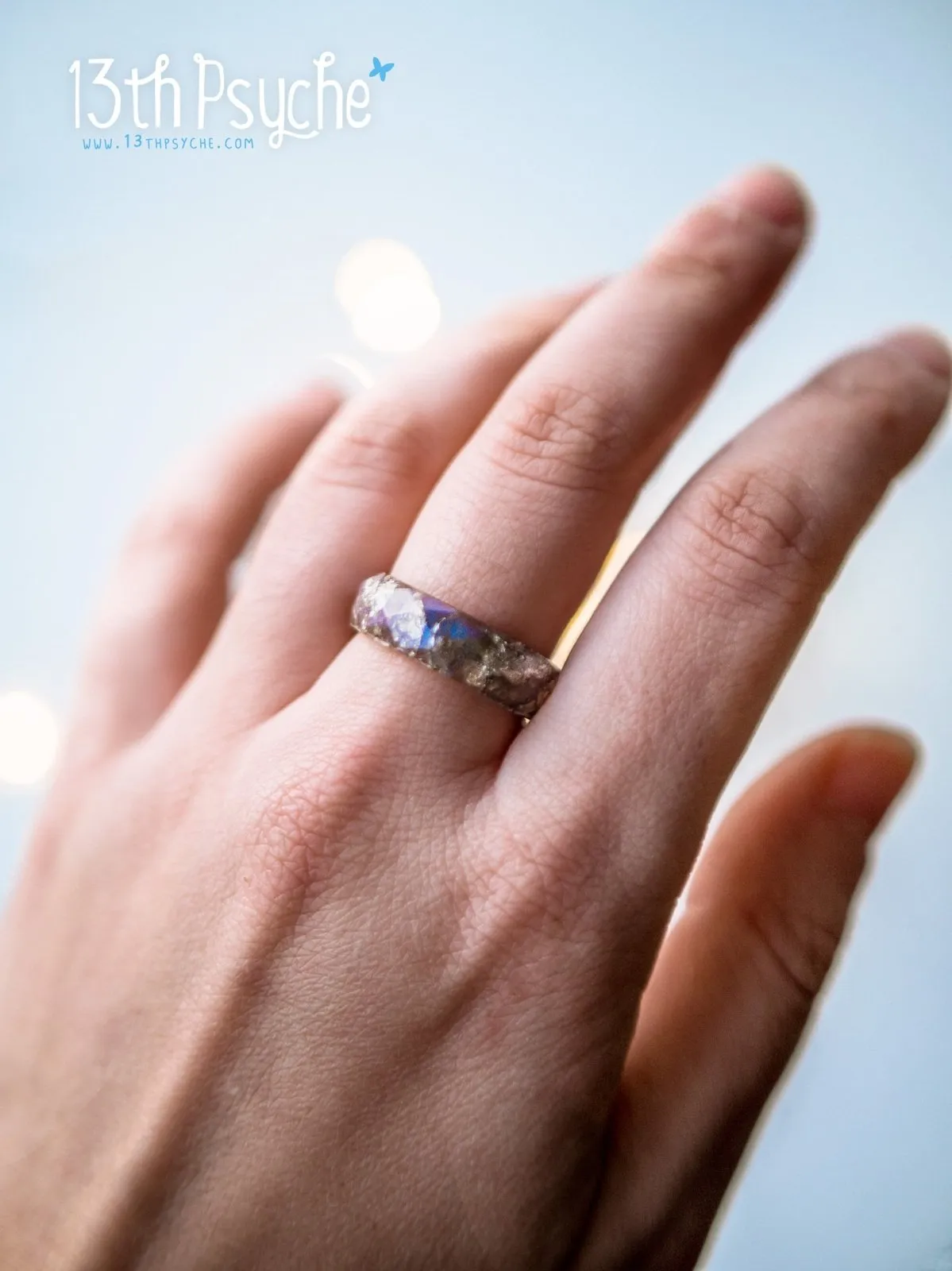 Iridescent grey faceted resin ring with silver flakes