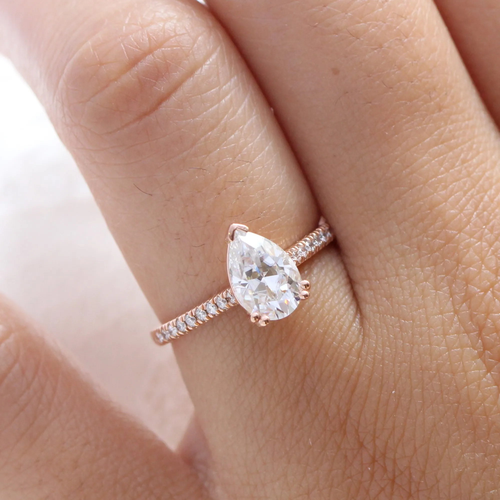 Pear Moissanite Engagement Ring in Grace Solitaire Pave Diamond Band