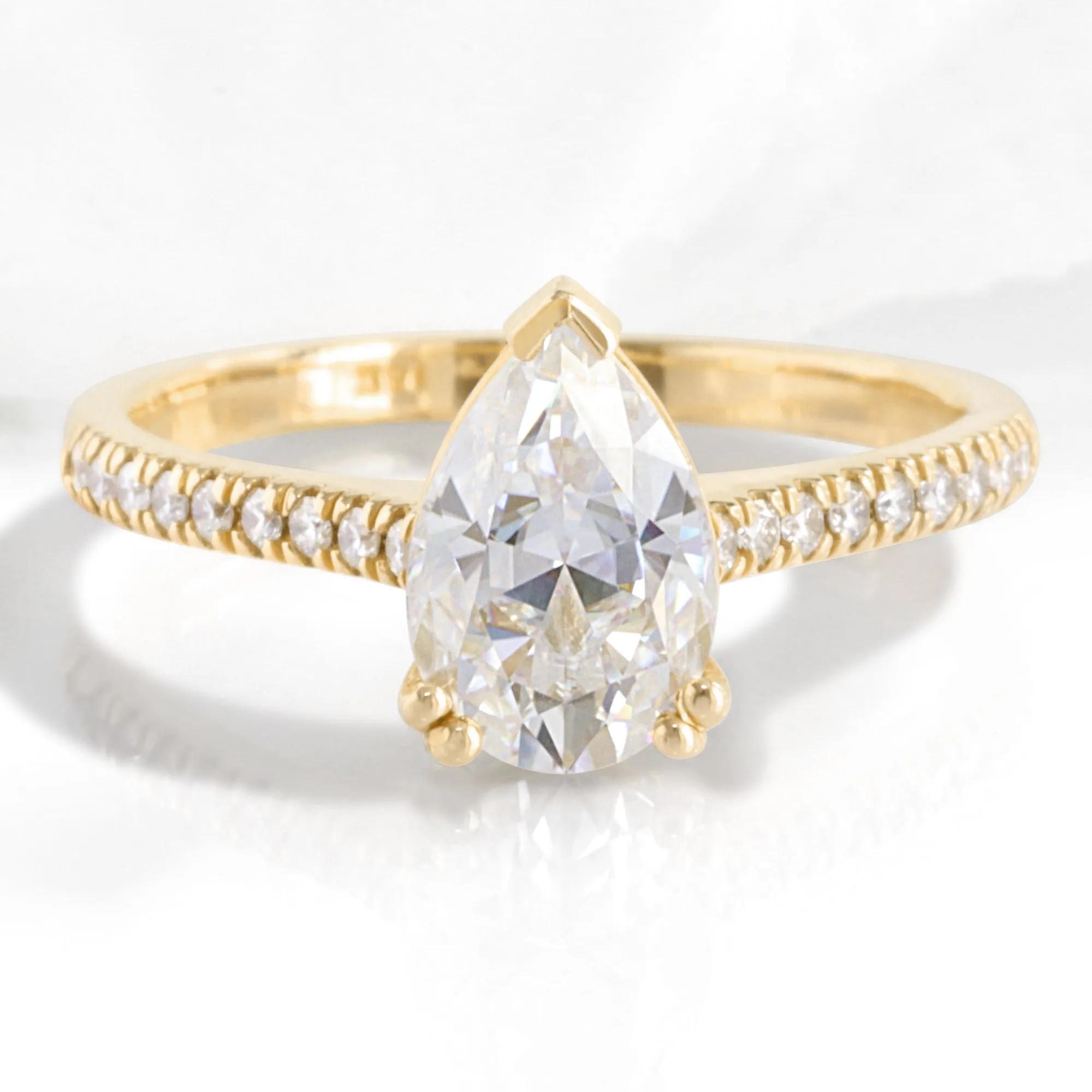 Pear Moissanite Engagement Ring in Grace Solitaire Pave Diamond Band