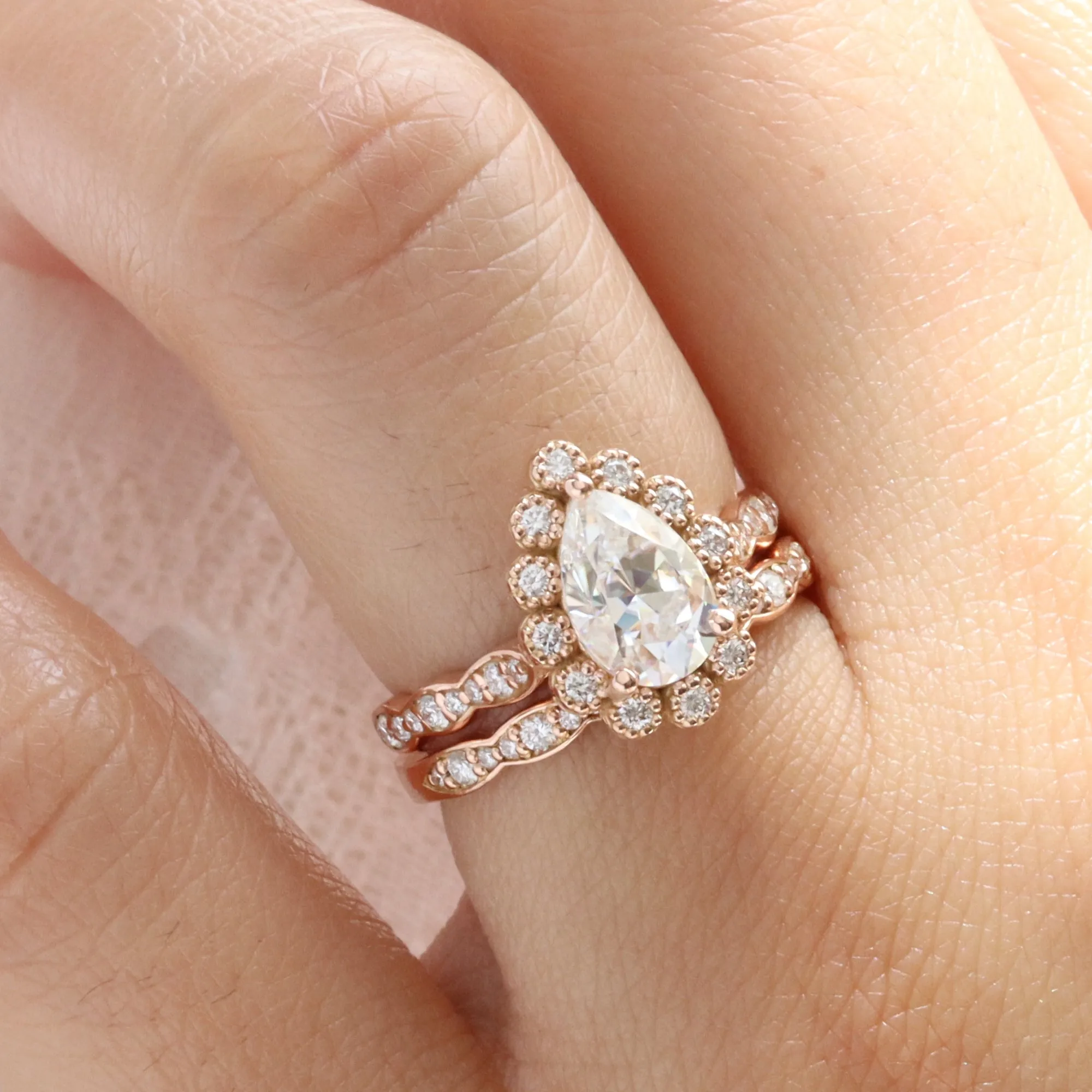 Pear Moissanite Engagement Ring in Vintage Luna Halo Diamond Ring