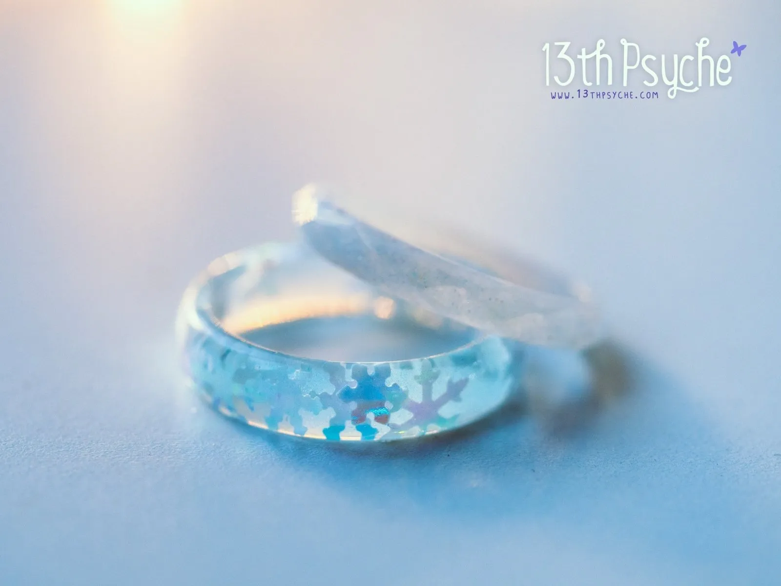 Winter inspired snowflake and white glitter resin ring set of two